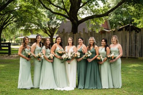 bride with bridesmaids in green gowns