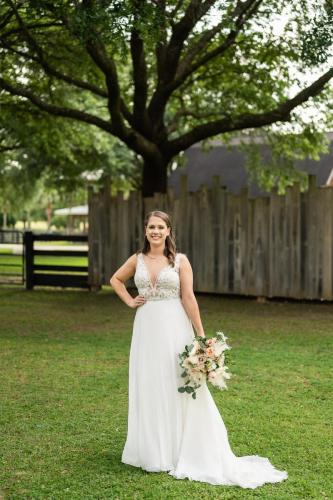 bride holding bridal bouquet outdoors