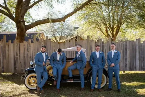 groomsmen with antique car